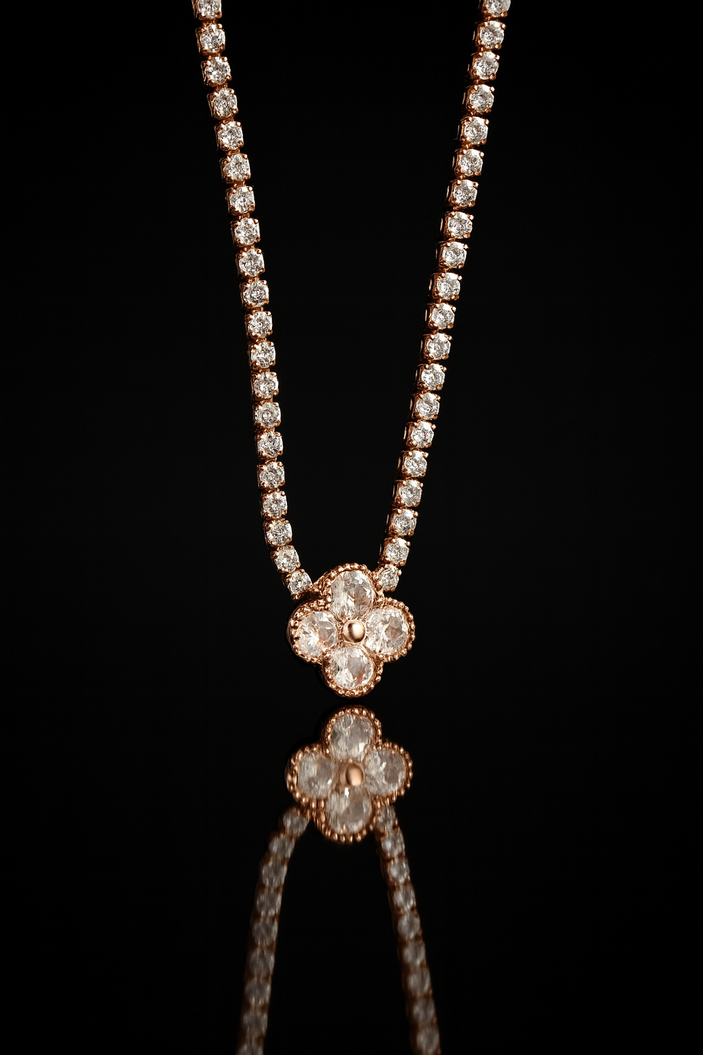 Jewelry set with floral pendant and beaded necklace on a black background