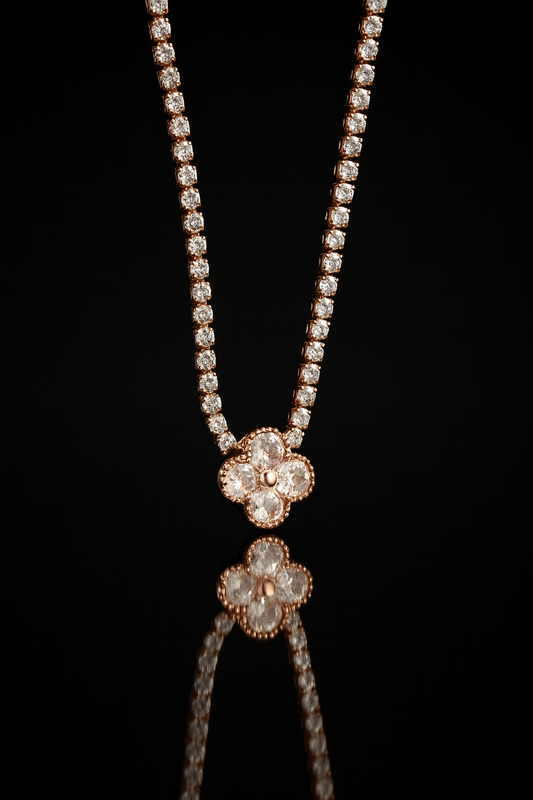 Jewelry set with floral pendant and beaded necklace on a black background